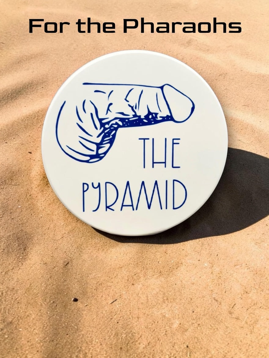 The Pyramid Dick Type coaster with navy penis illustration standing in desert sand — For the Pharaohs