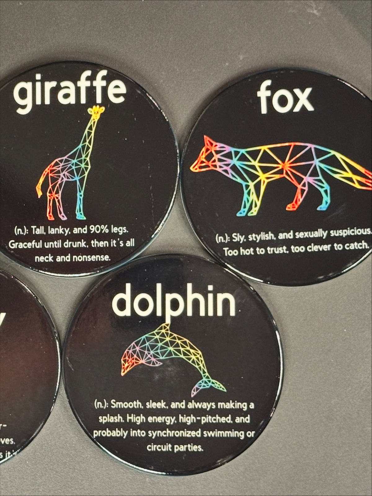 Giraffe, fox, and dolphin animal archetype coaster designs